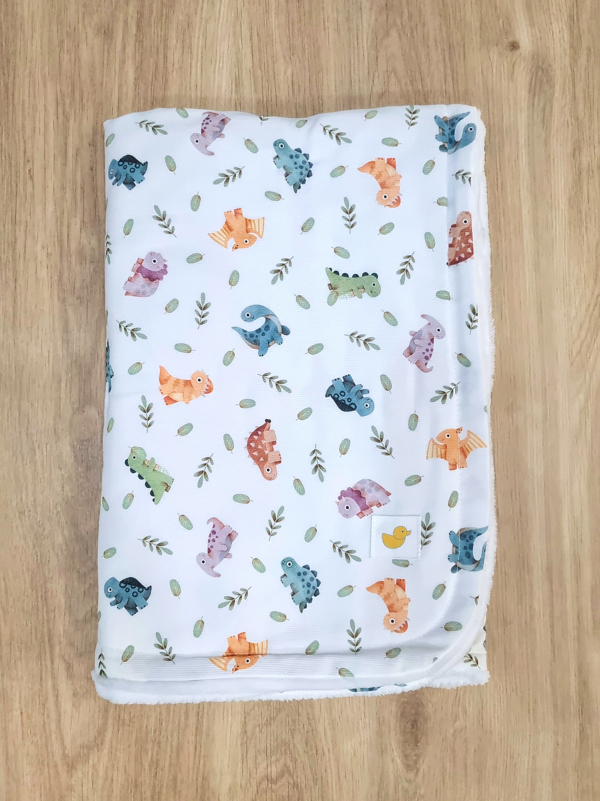 Colcha Polar. Dinosaurios de colores