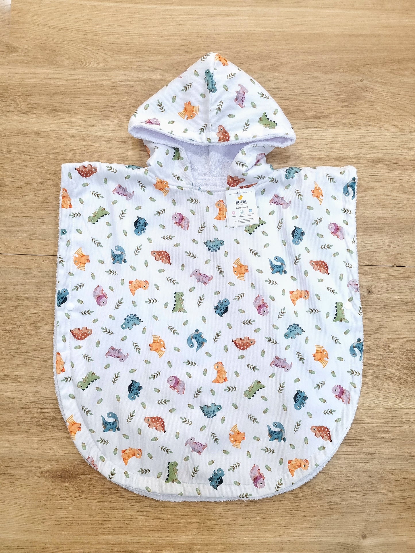 Toalla Poncho. 0 a 2 años. Dinosaurios de colores